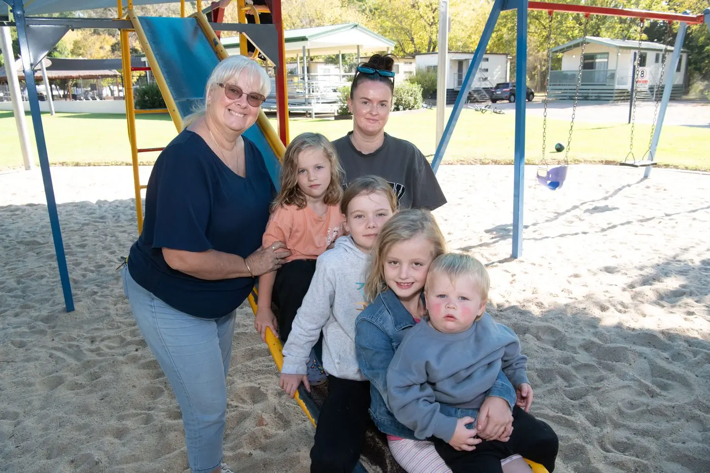 EASTER FUN: Kylie Dowell from Painters Island Holiday Park with Amelia Wallace, Daisey Edgar, Britney Daniel, Scarlett Edgar and Coleson Wallace, enjoying the park\\'s playground. PHOTO: Kurt Hickling